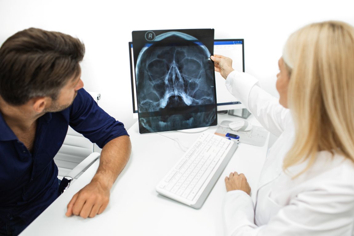 Sinus Surgery Xray doctor and patient examining sinus scan